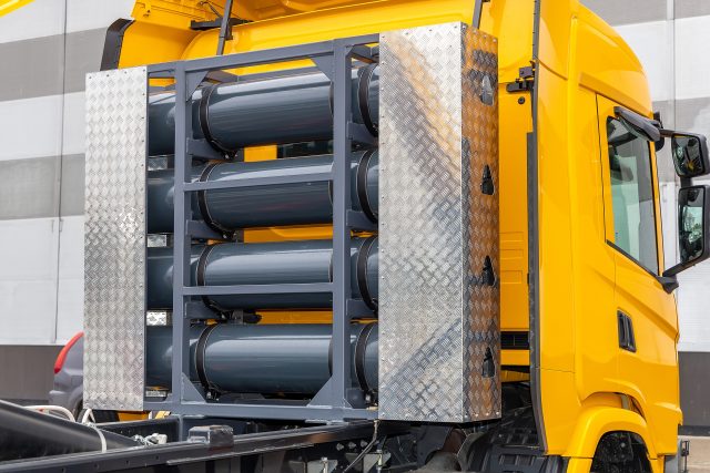 Compressed natural gas cylinders behind the truck cab.